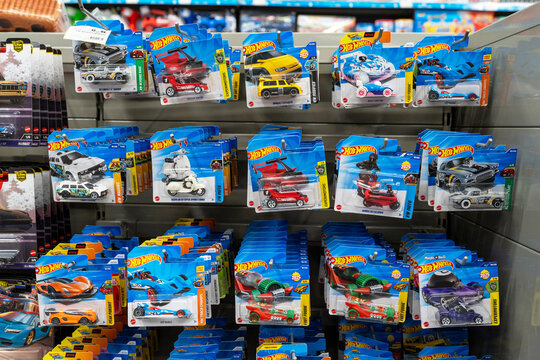 Hot Wheels car toy collections. A retail display case featuring Hot Wheels die-cast toy cars in a toy store. Hot Wheels is a brand product of Mattel. Minsk, Belarus - June 10, 2026