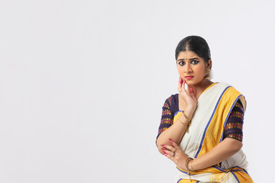 Mohiniattam dancer in Hamsapaksha mudra looking with worried expressions