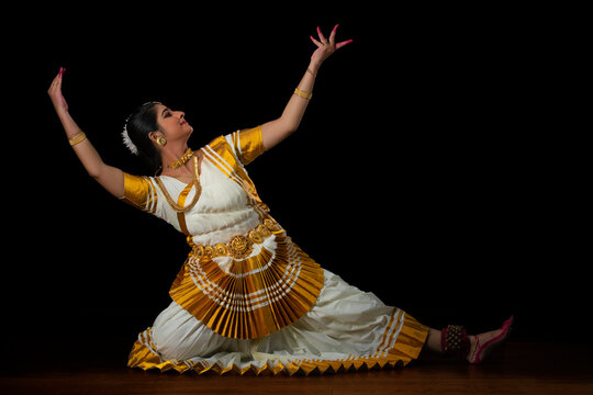 Mohiniattam dancer representing Lord Padmanabha sitting with a flower