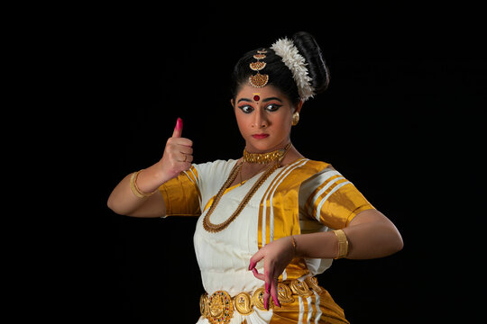 Mohiniattam dancer representing the character of Goddess Durga with a Trishul in her hand
