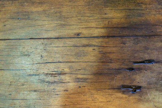 Close-up of scarred old wooden tabletop
