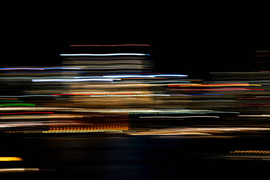 Horizontal light trails on dark background