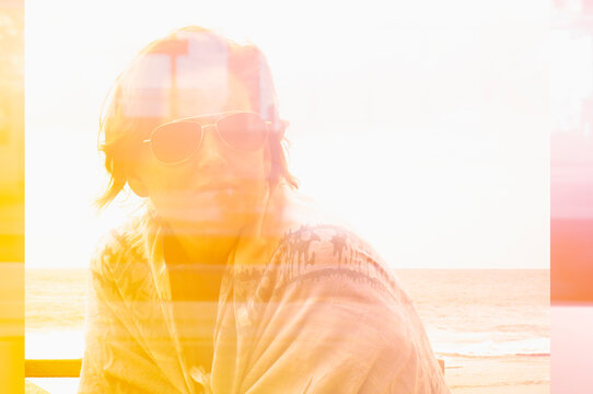 Composite image of woman with sunglasses looking to side 