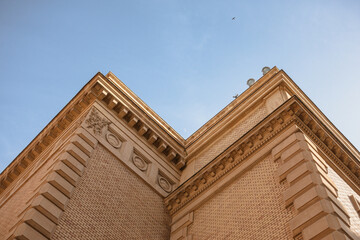 Historic Building Corner with Crescent Moon in Blue Sky © Mariya