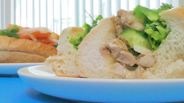Macro cross section of fresh Vietnamese banh mi sandwich with chicken