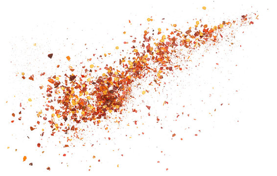 Spicy chili red pepper flakes close up, chopped, milled dry paprika pile isolated on white background