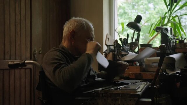 Elderly craftsman working in his old workshop, carefully restoring collectible Japanese bladed weapons