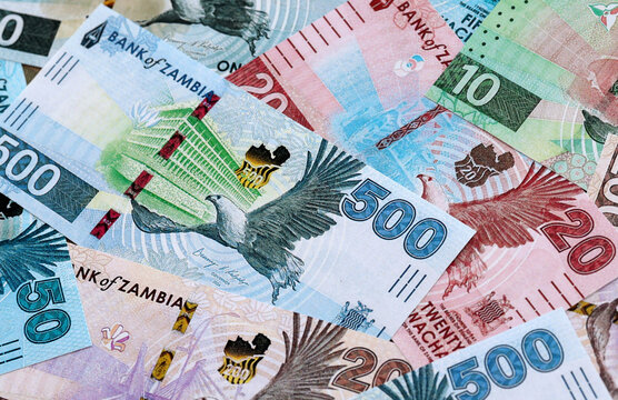 Zambian kwacha money banknotes pile on table. Zambia bills of ZMW currency close up
