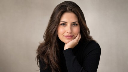 Fototapeta premium Confident Brunette Woman Poses For Professional Corporate Portrait Reflecting Success And Sophistication Against A Clean Neutral Studio Backdrop