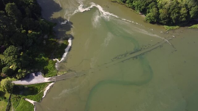 Aerial drone view of flooded tidal road in Aveton Gifford, South Devon, England