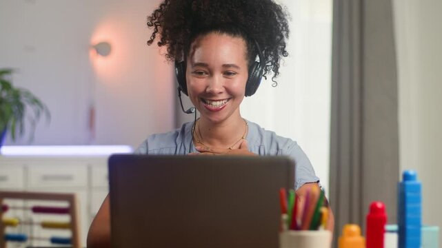 Happy Black Woman Online Teacher With Natural Hair Conducts a Remote Learning Session