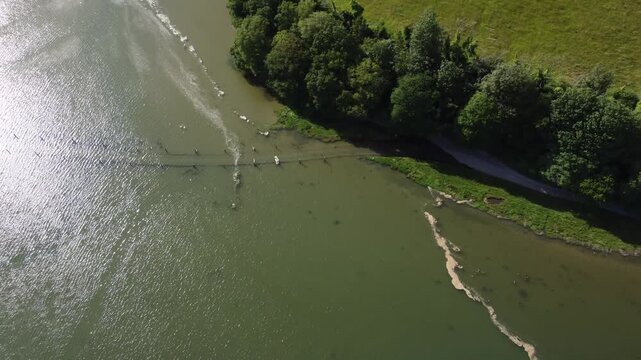 Aerial drone view of flooded tidal road in Aveton Gifford, South Devon, England