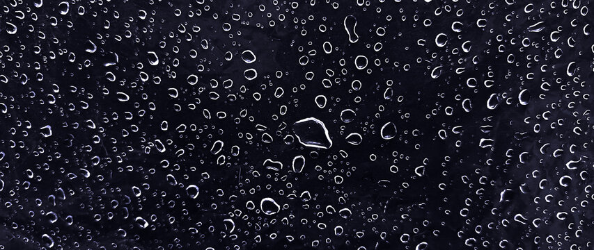 Water drops on dark surface background texture with condensation and rain droplets pattern, abstract background with fresh water droplets texture for banner and backdrop design. not ai