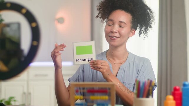 Joyful Online Teacher With Natural Hair Explains Geometric Shapes for Remote Learning
