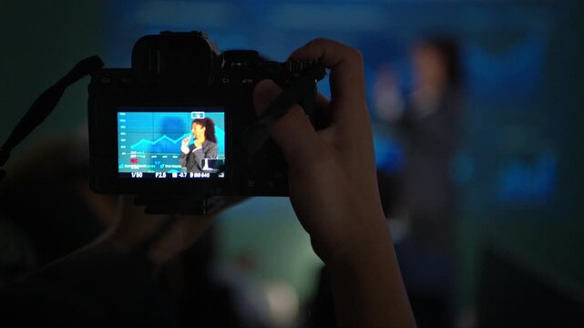 Businesswoman presenting digital analytics and AI powered business insights with a tablet during a corporate meeting in a modern technology office