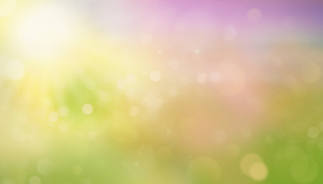 Abstract blurred sunny background with soft yellow, orange, and green tones. Bright bokeh light and warm sunshine create a cheerful and dreamy summer or autumn atmosphere