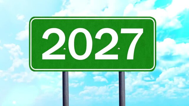 2027 Green Road Sign Against Bright Blue Sky and White Clouds Concept