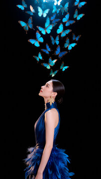 Portrait of Young Woman Surrounded by Blue Butterflies. AI generated