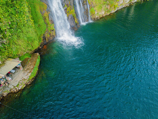 Aerial drone view of greenery hills with Situmurun Waterfall near Toba Lake at Lumban Juju in Toba, Sumatera Utara, Indonesia © MUAZ JAFFAR