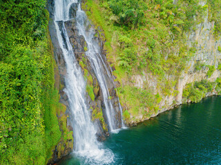 Aerial drone view of greenery hills with Situmurun Waterfall near Toba Lake at Lumban Juju in Toba, Sumatera Utara, Indonesia © MUAZ JAFFAR