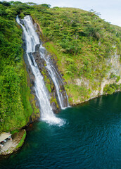 Aerial drone view of greenery hills with Situmurun Waterfall near Toba Lake at Lumban Juju in Toba, Sumatera Utara, Indonesia © MUAZ JAFFAR