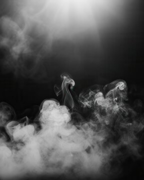 Abstract white smoke swirls against a dark background. Great for overlays.