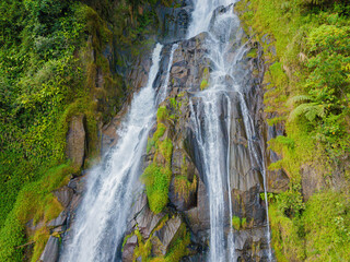 Aerial drone view of greenery hills with Situmurun Waterfall near Toba Lake at Lumban Juju in Toba, Sumatera Utara, Indonesia © MUAZ JAFFAR