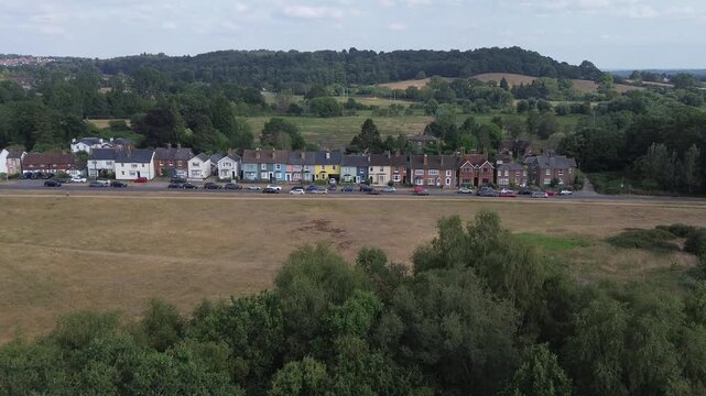 REIGATE, SURREY - UK:- Colourful terraced houses overlooking Reigate Heath.  Aesthetic old cottages in rural England, in the London commuter belt. 