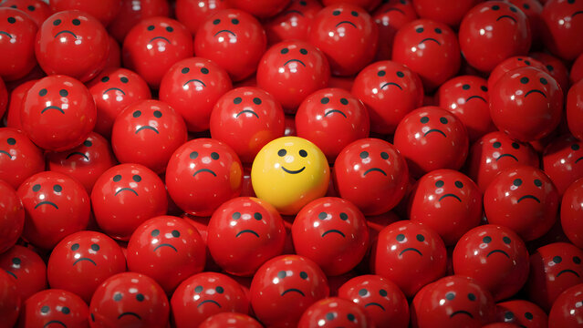 A single yellow happy smiling ball surrounded by many sad red frowning balls