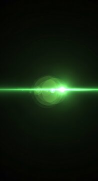 Glowing green light streak in dark space.