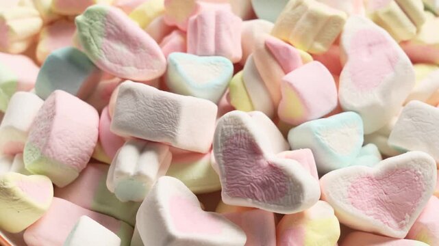 Pastel-colored heart and cube marshmallows in soft-focus close-up for confectionery packaging and Valentine&rsquo;s Day marketing