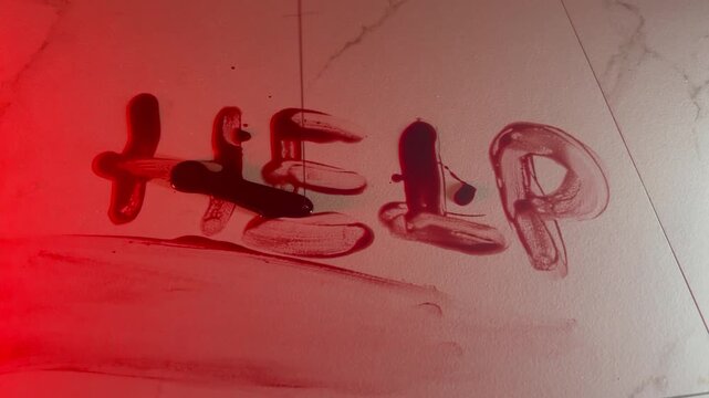 help written in blood on wall with fake blood pouring