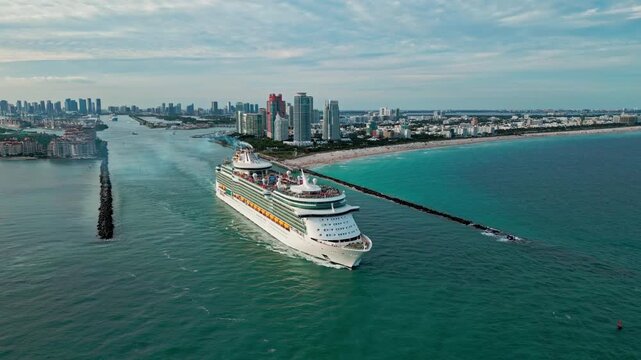 January 2, 2025 - Miami Beach, Florida: Aerial view Cruise ship independence of the seas sailing next to Miami South Beach. . independence of the seas is Royal Caribbean cruise ship sailing near South