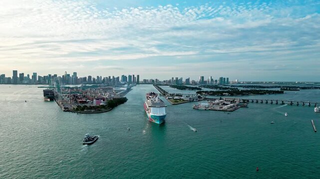 December 13, 2024 - Miami Beach, Florida: Aerial view Cruise ship Norwegian Breakaway sailing next to Miami South Beach. Cruise liner Norwegian Breakaway sailing from Miami Miami harbor. Cruiseship