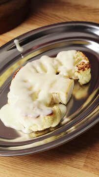 White sauce pours over cauliflower, starting classic cauliflower cheese. Cauliflower cheese bakes until golden and bubbling on top. Cauliflower cheese makes comforting side dish for Sunday roast.