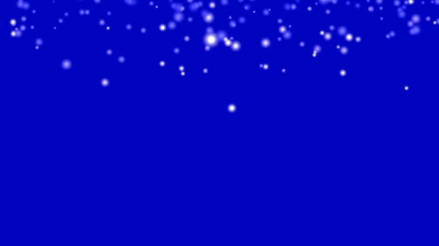 Seamless animation of glowing white snow falling down against a blue screen background