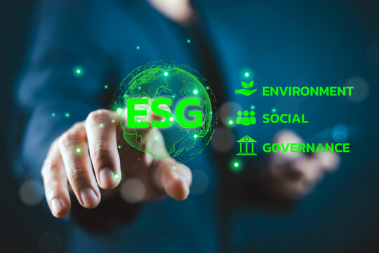 Business leader interacting with a digital ESG interface highlighting environmental, social, and governance principles, sustainability strategy, corporate responsibility, green innovation.