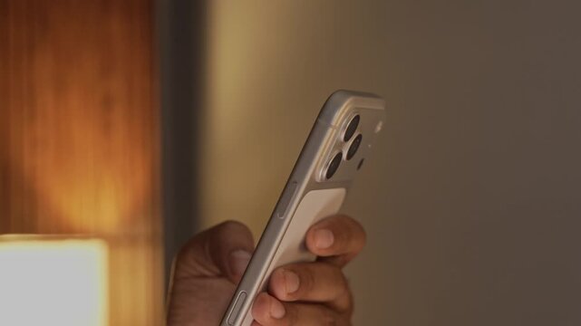 Person Using Smartphone Scrolling and Browsing on Mobile Phone
