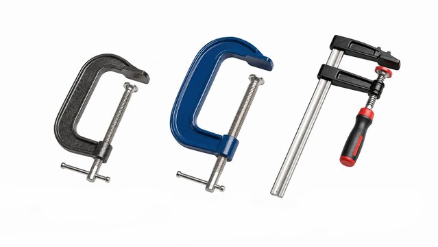 Set of three professional carpentry clamps: two C-clamps and one F-clamp isolated on white background