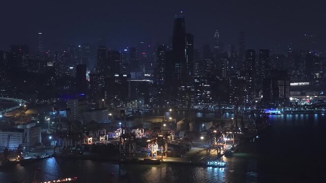 Unloading large cargo containers seaport. Loading freight sea port. Top aerial drone view. Lot big boxes rows, ship delivery ocean harbor. Shipping night. Goods export import. Industrial Marine dock.