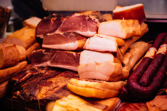 Different meats and sausages on sale at the market.