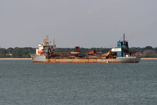 Southampton Water England Uk. 23.07.2026. MV City of London a specialised hopper dredger ship with extensive pipework and conveyor systems is navigating through calm waters