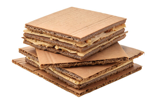 Pile of Torn and Ruined Brown Cardboard Sheets Isolated on White Background