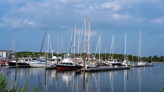 Sailboats and other boats in a marina in Oxford, Maryland