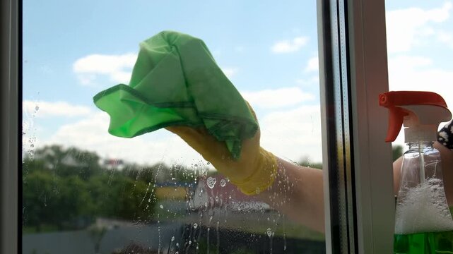 Washing windows spring cleaning. Selective focus.
