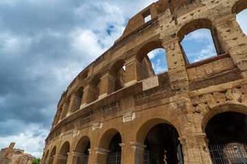 Obraz premium Majestic stone and brick architecture of the ancient Colosseum in Rome, Italy