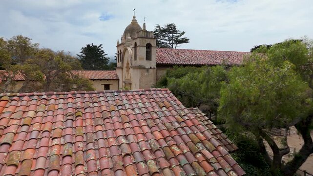 Views show the Mission church in Carmel, California, highlighting rooftops and trees around the area.
