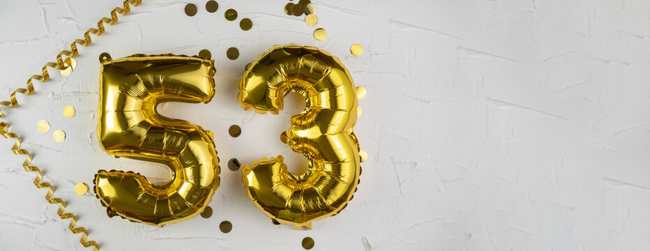 Yellow Gold foil balloon number fifty-three on white background. Birthday card with lettering 53. Anniversary concept. For anniversary, birthday, wedding event, new year celebration. Banner