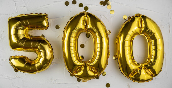 Holiday Party Decoration. Balloons for celebration 500th Anniversary. Golden Number 500 Balloons on white background.