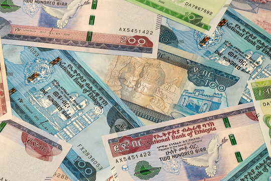 Ethiopian birr money bills in pile on table. Ethiopia ETB currency cash close up